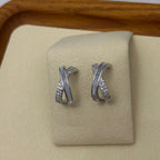 crossed earrings